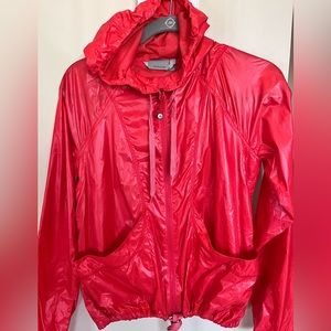 Athleta windbreaker, orange size XS. Very cool for gym or outside activities .
